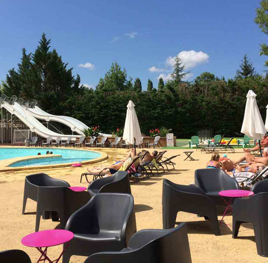Water park on Le Chêne Vert campsite, Occitanie, with sunbeds